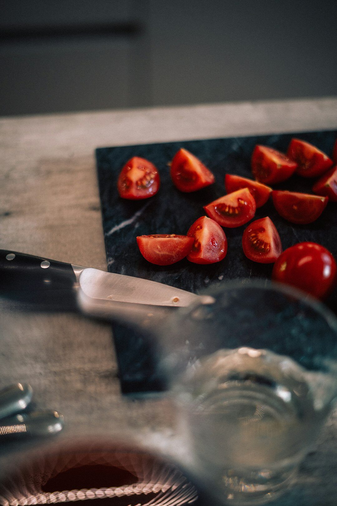 fresh tomatoes and herbs on wooden table